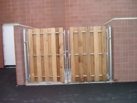 Dumpster Enclosure Board on Board attached to Masonry